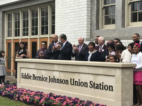 Reps. Hoyer in a group behind a sign for the Eddie Bernice Johnson Union Station